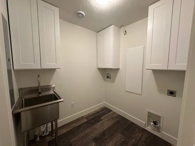 Laundry room with cabinets for storage