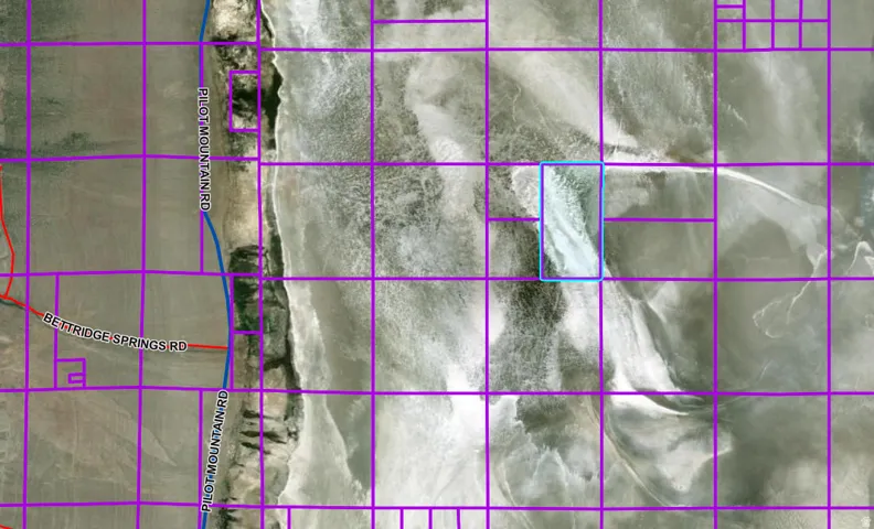 Aerial map of property and surrounding area featuring property parcel outlined