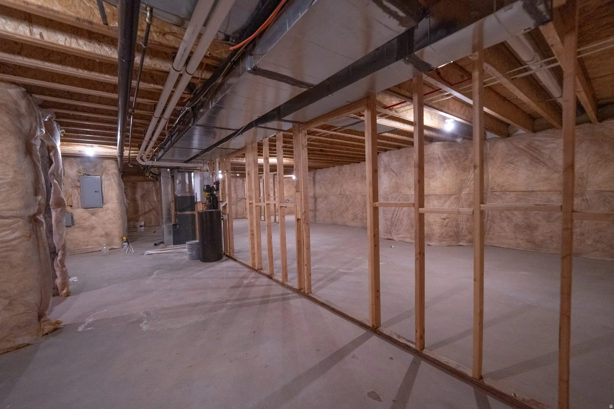 Unfinished basement featuring electric panel
