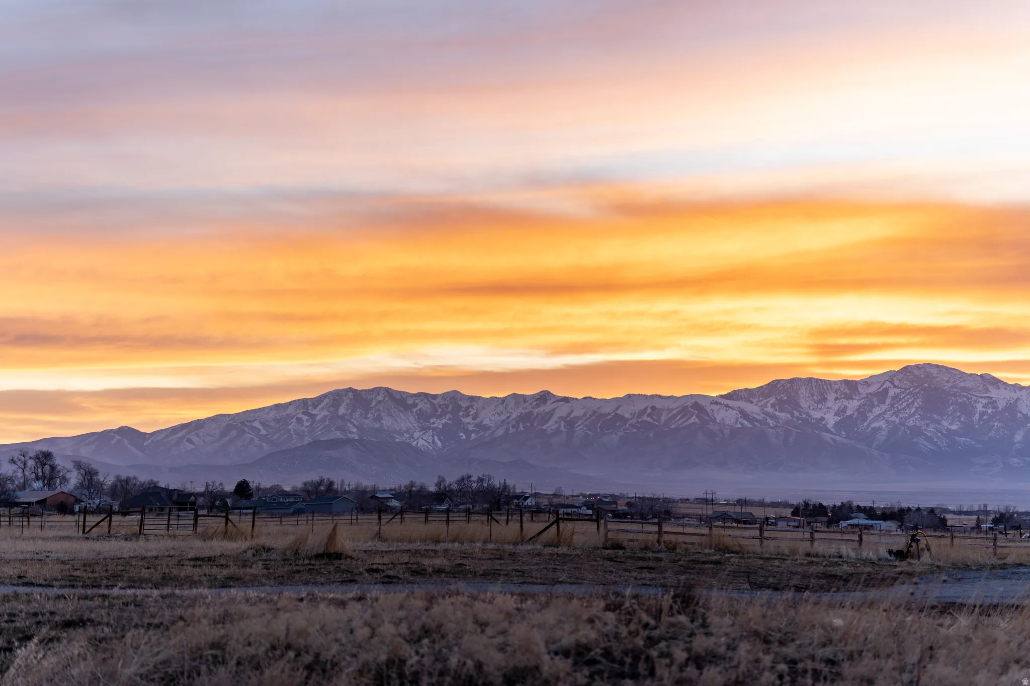View of mountain backdrop with rural landscape