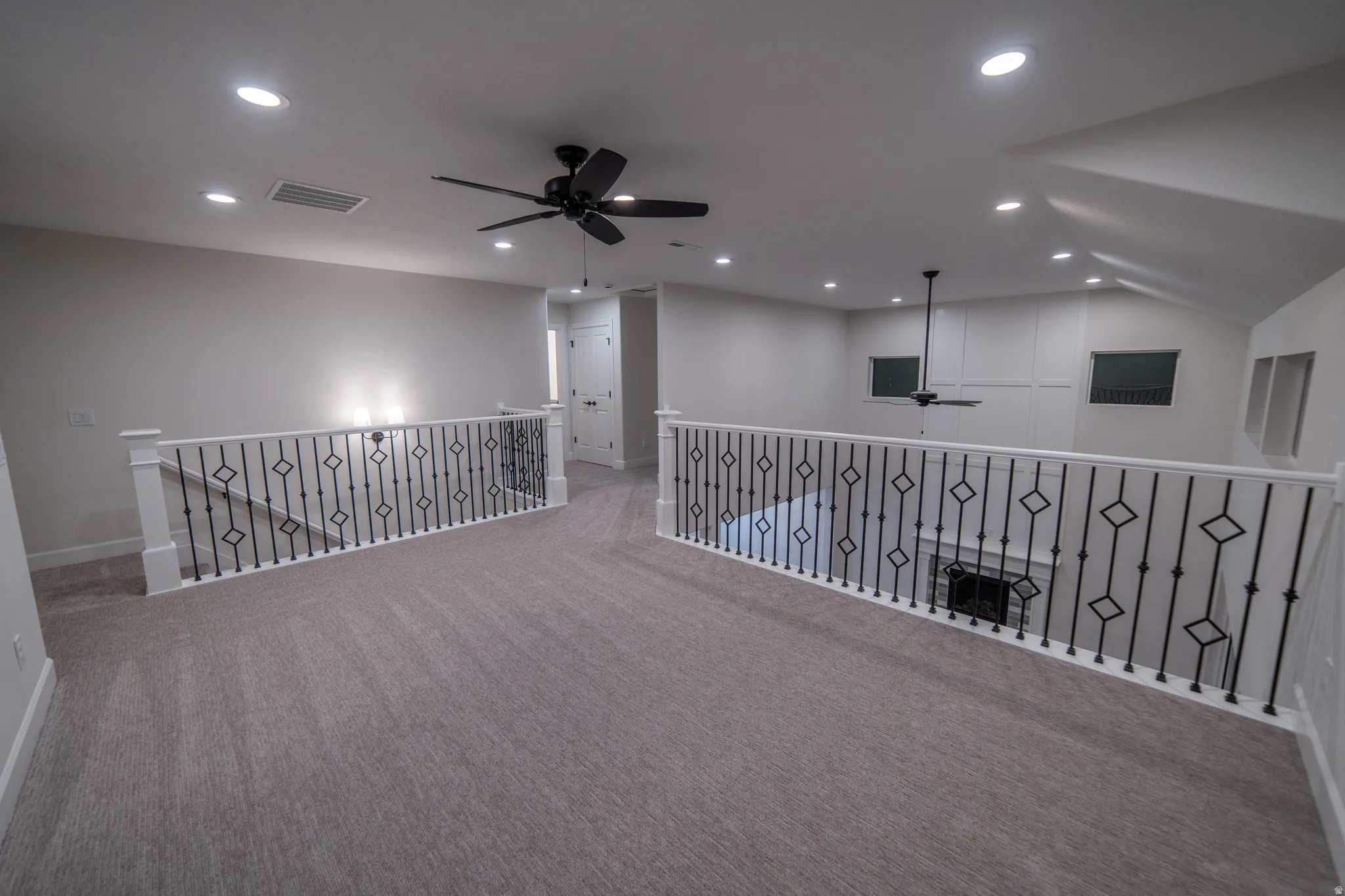 Corridor with carpet and recessed lighting