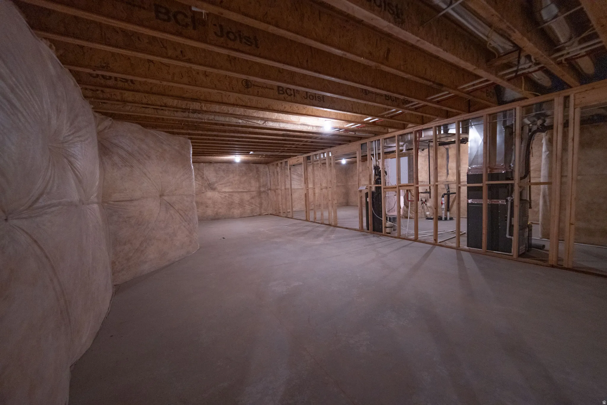 Unfinished basement with heating unit
