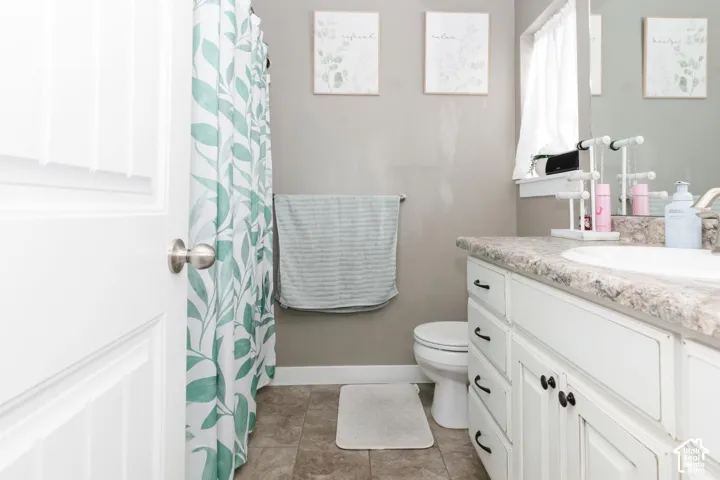 Primary full bathroom featuring vanity and curtained shower