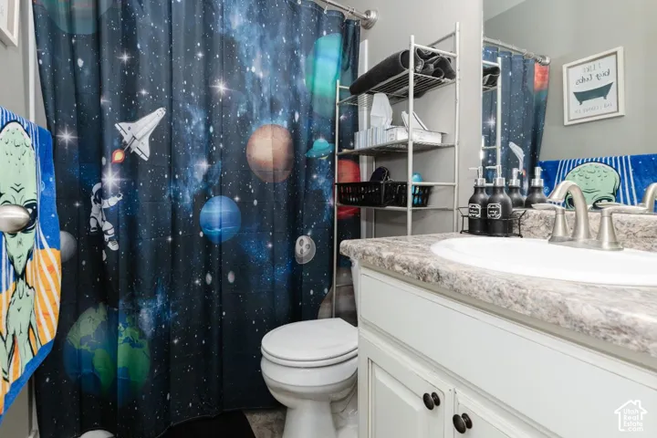 Full bath 2  featuring a shower with curtain and vanity