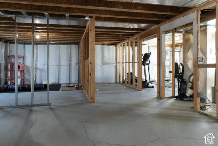 Basement featuring heating unit