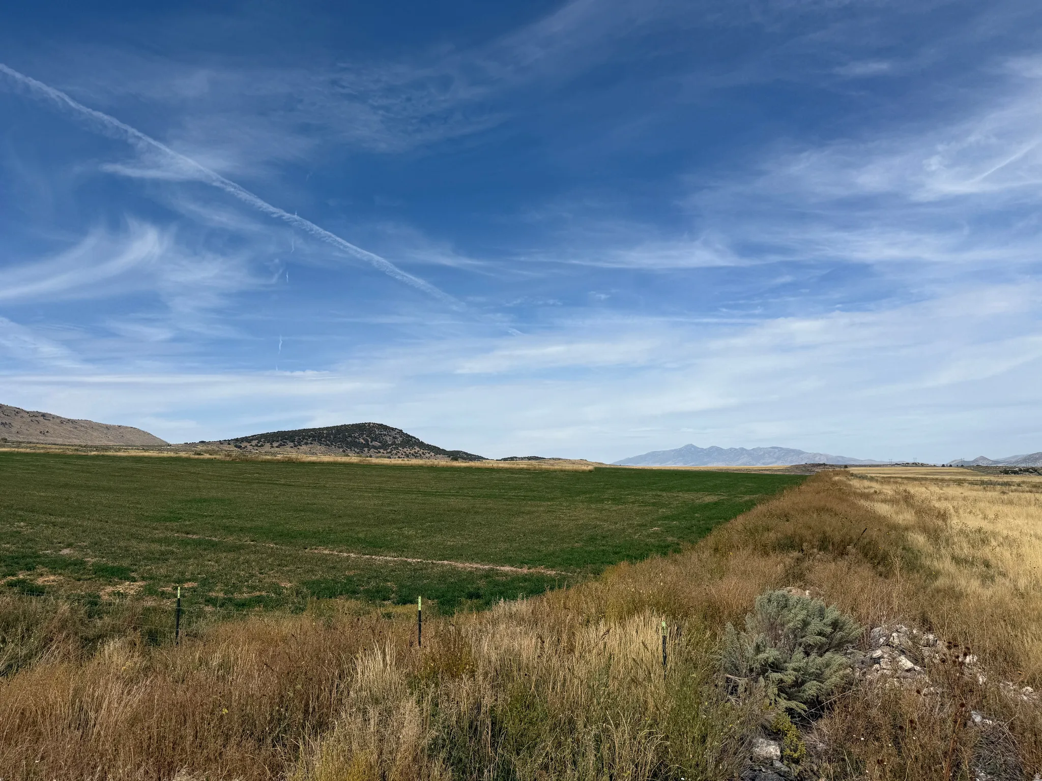 View of mountain background featuring rural landscape