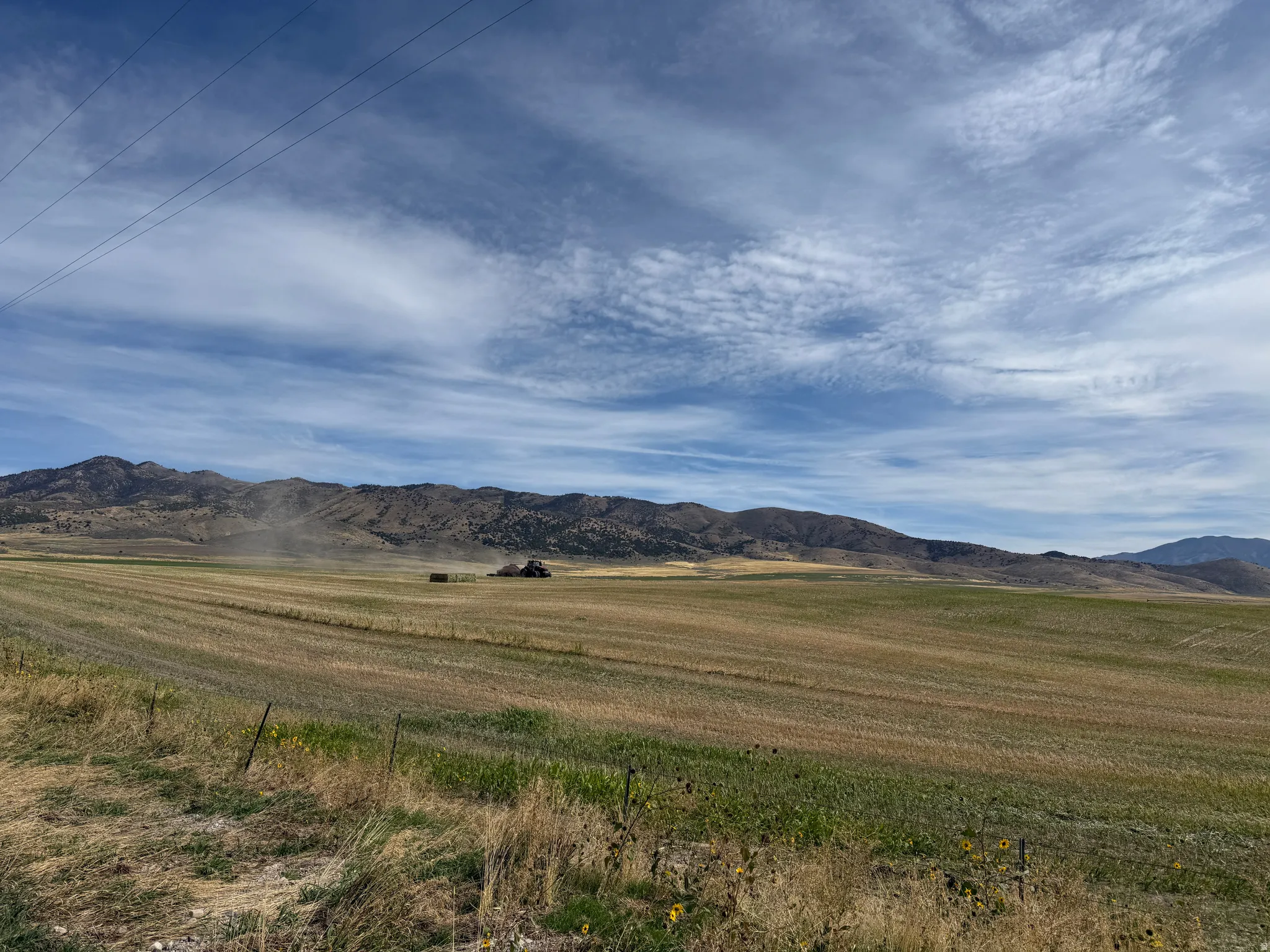 View of mountain background featuring rural landscape