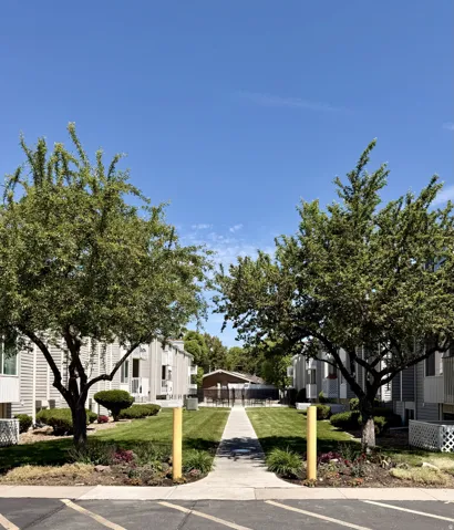 Central walkway flanked by manicured lawns and mature trees