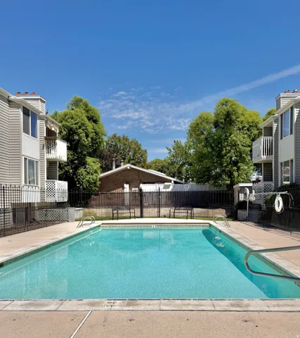 Community swimming pool with concrete decking