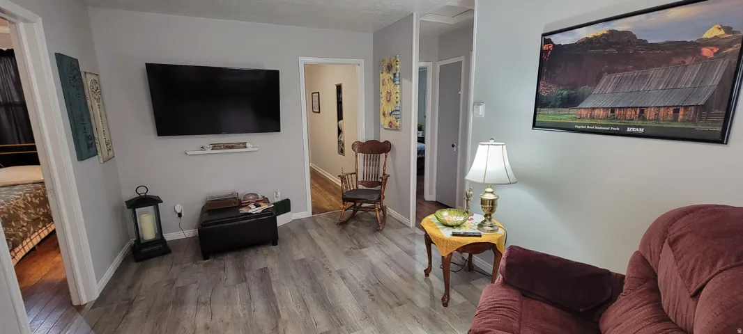 Living area featuring wood finished floors and baseboards