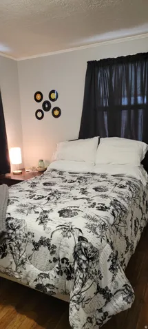 Bedroom with original hardwood floors.