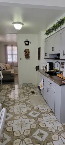 Kitchen with dark countertops and open floor plan