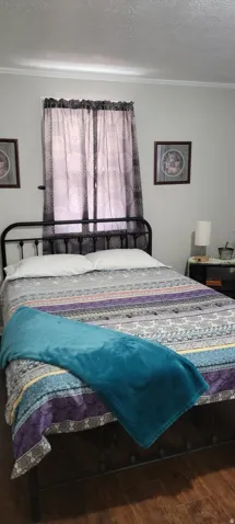 Bedroom featuring hardwood  floors