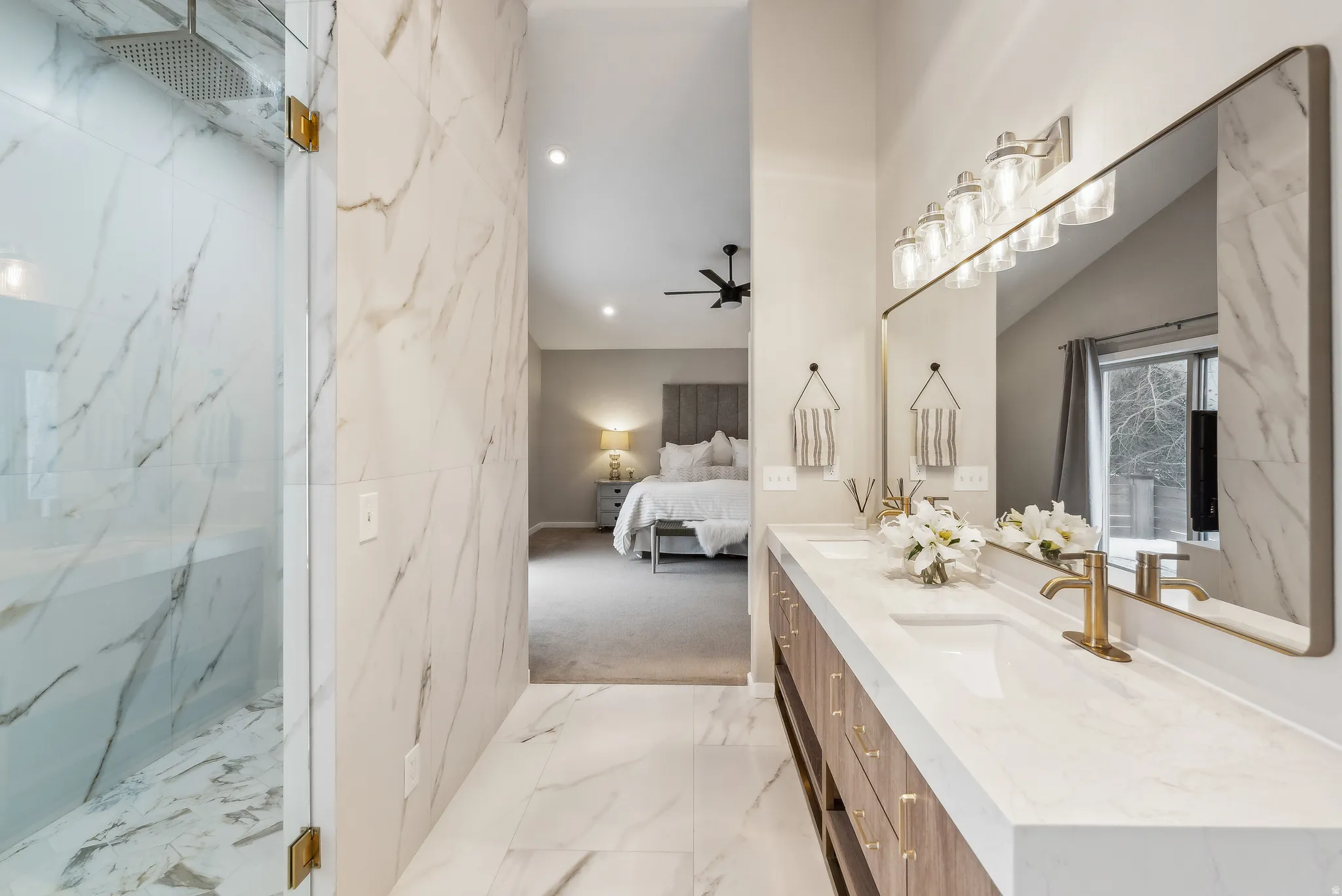 Dual vanity with integrated sinks and gold-finish fixtures
