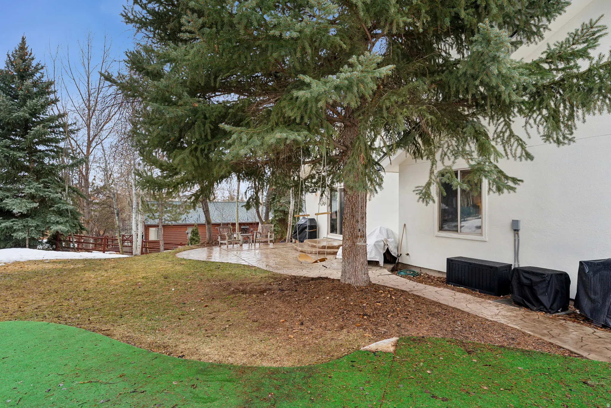View of grassy yard with a patio