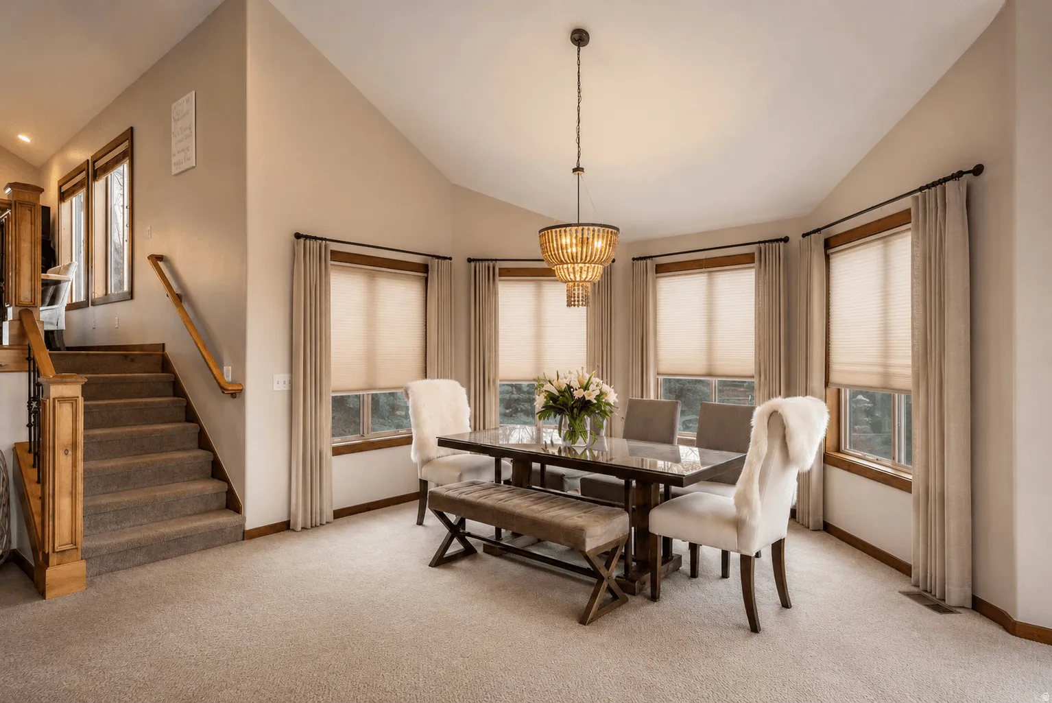 Vaulted ceilings with a tiered chandelier