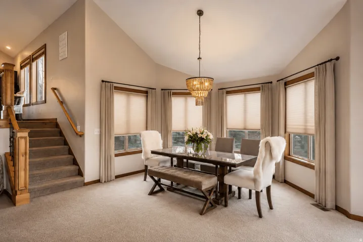 Vaulted ceilings with a tiered chandelier