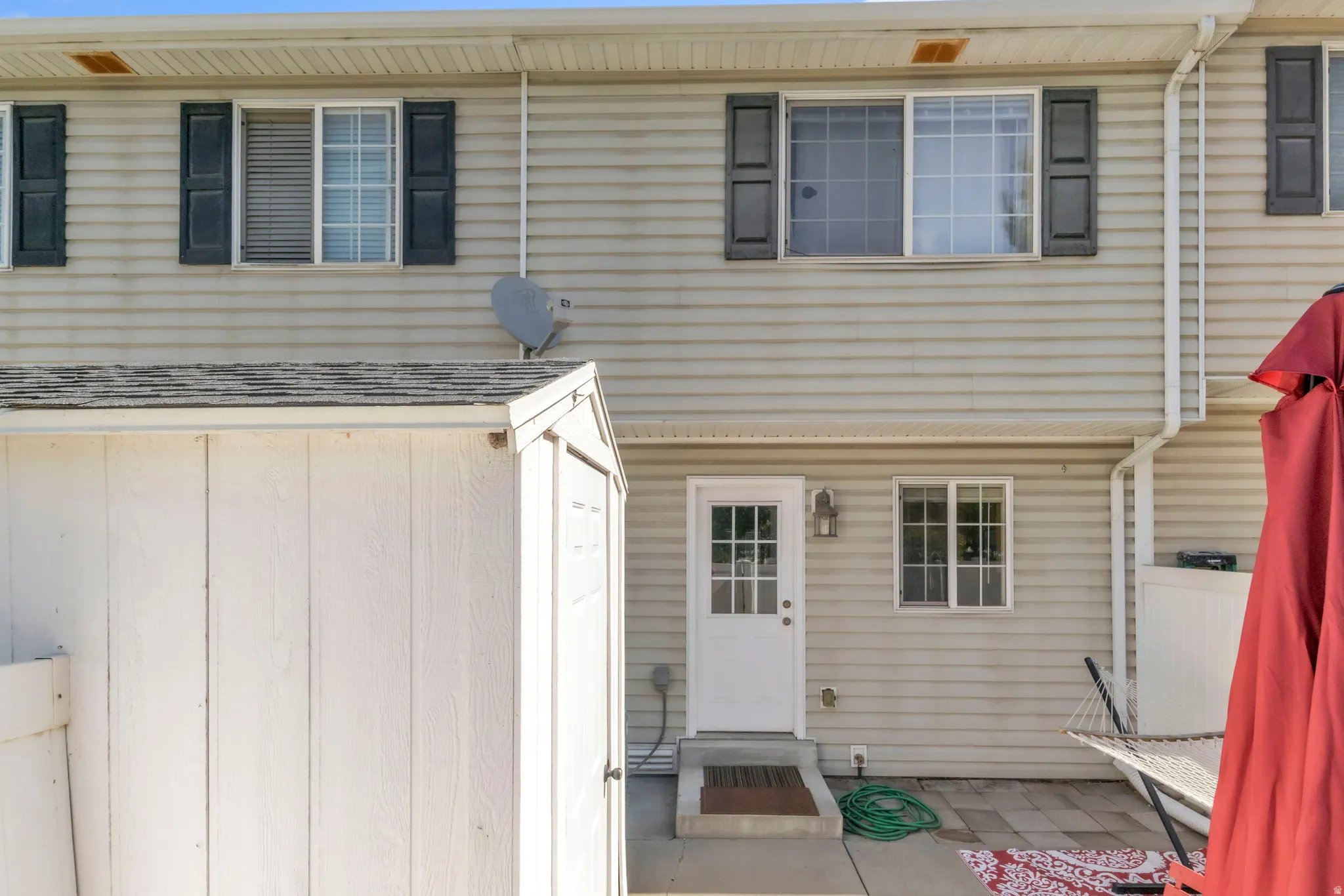 Back of property featuring a patio area