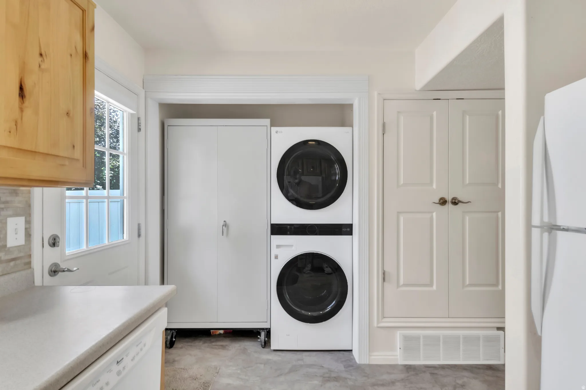 Laundry room with stacked washer / drying machine