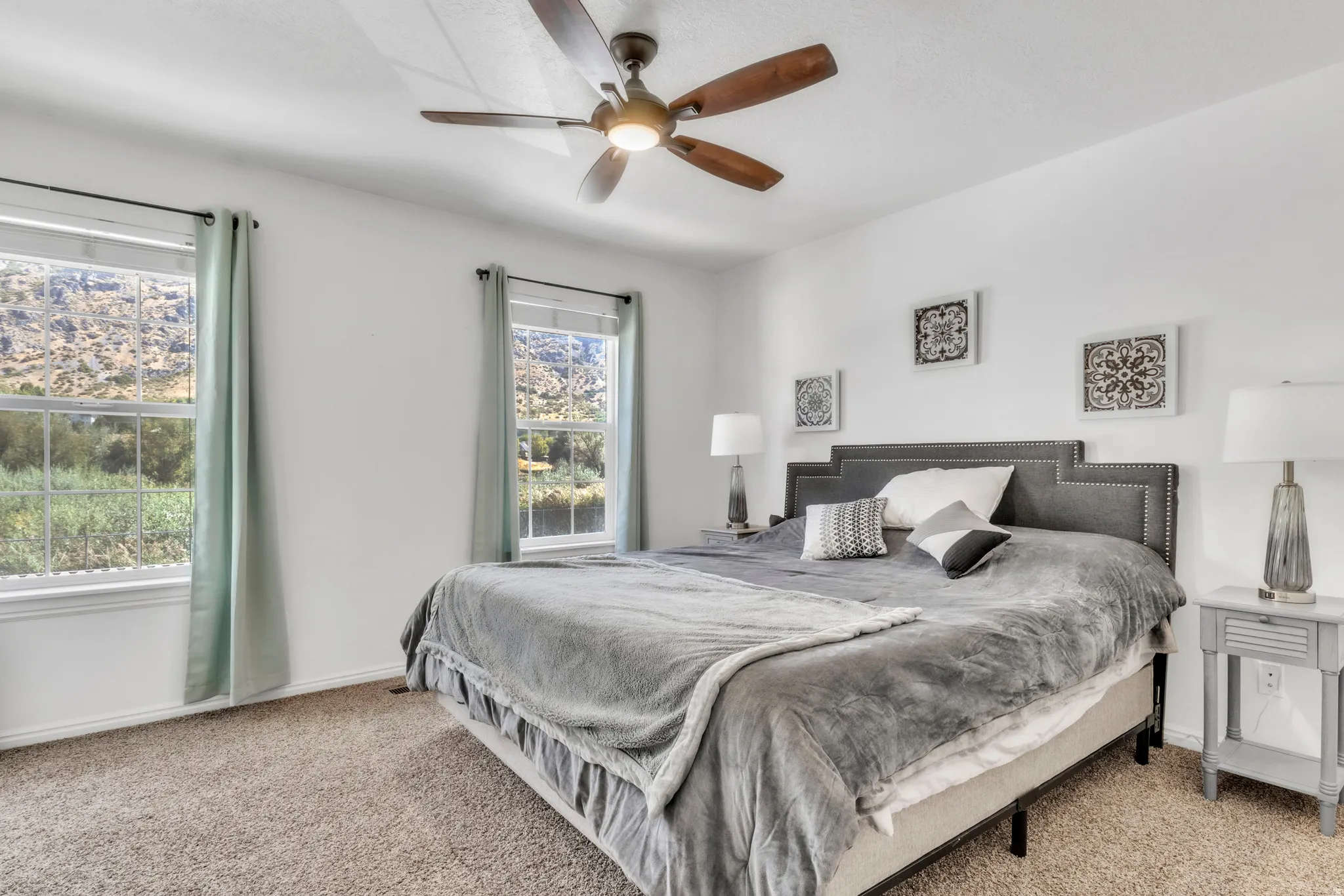 Bedroom featuring carpet flooring and a ceiling fan