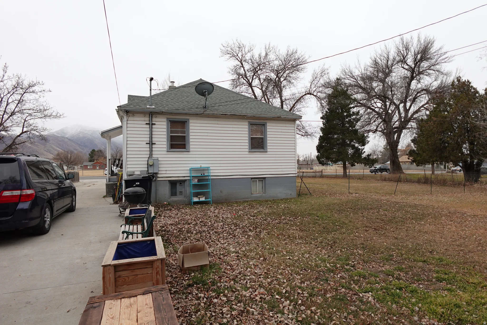 View of property exterior with roof with shingles