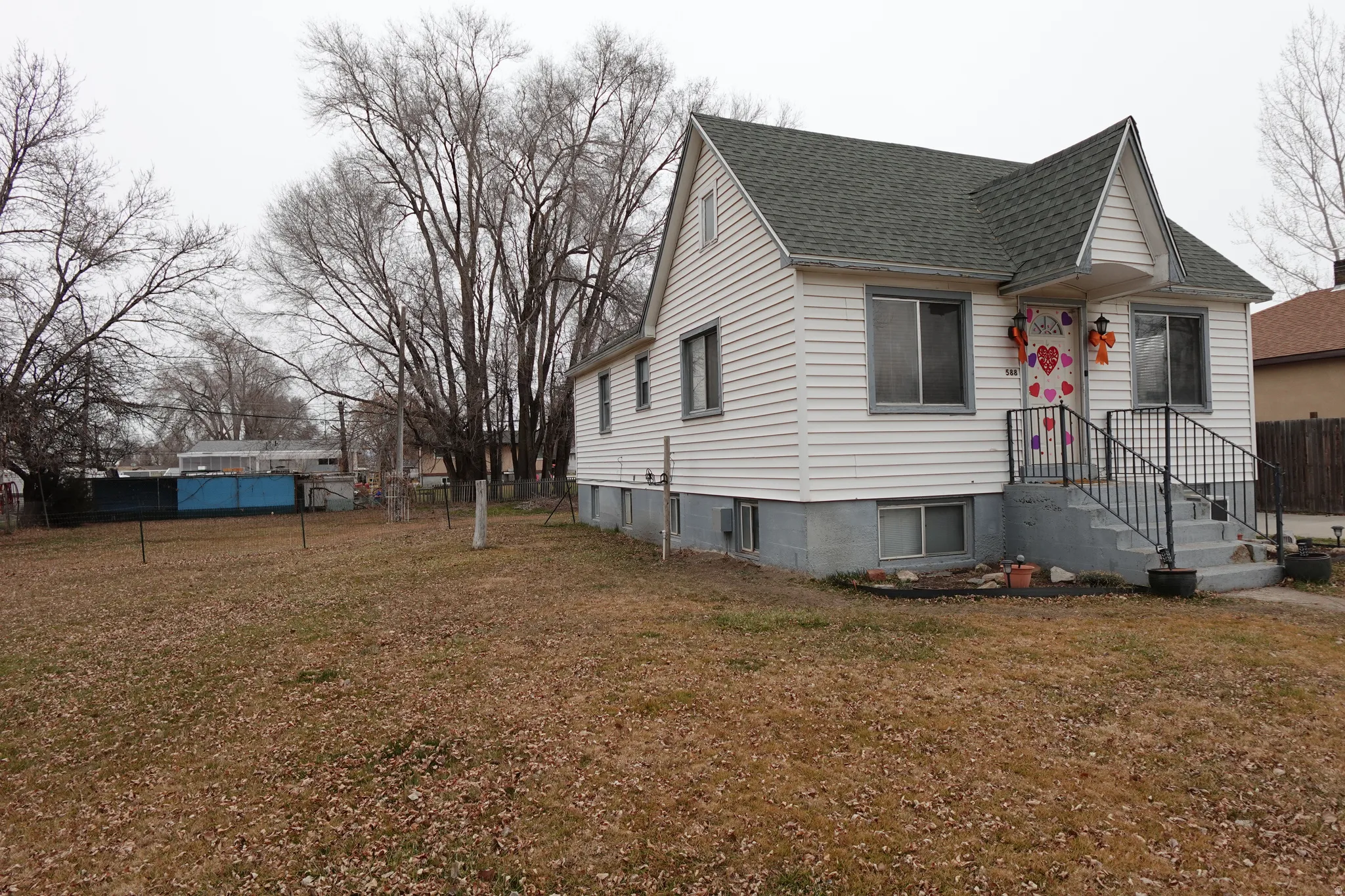 View of front of home with roof with shingles