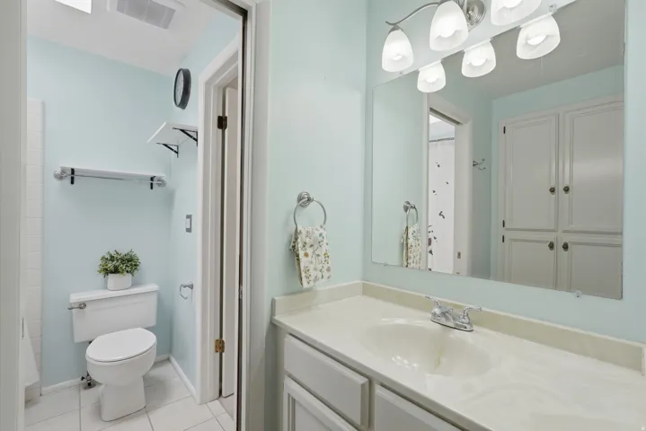 Bathroom with built in storage and huge garden tub.