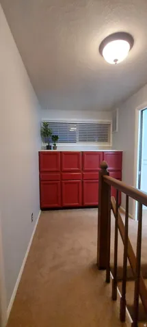 Landing area on second floor with built in storage.