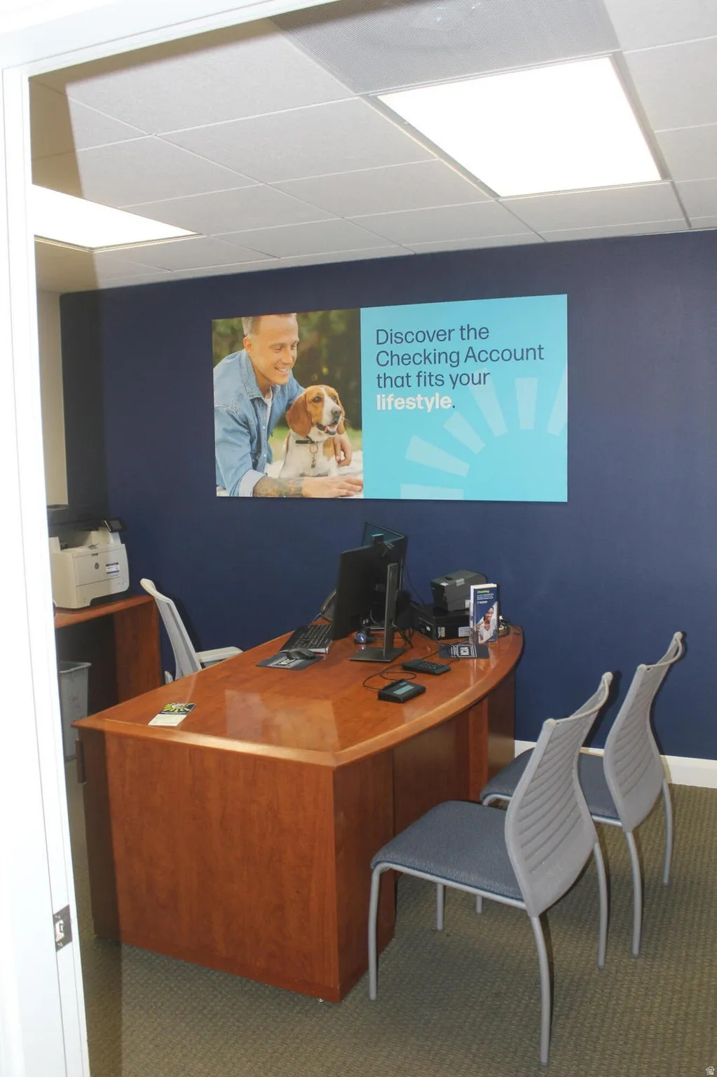 Office area with a paneled ceiling