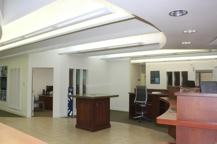 Office with recessed lighting and built in desk