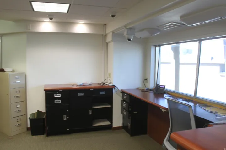 Unfurnished office featuring carpet floors and a drop ceiling