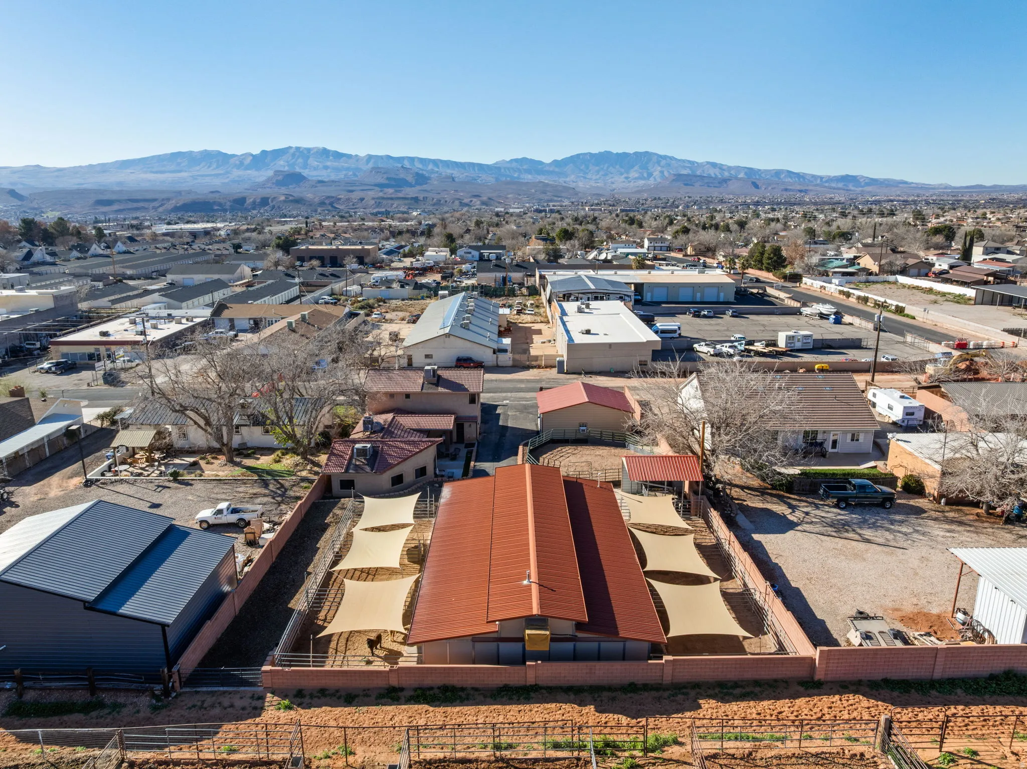 Aerial perspective of suburban area with a mountain backdrop