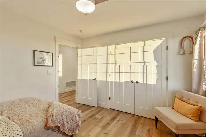 Bedroom with light wood finished floors
