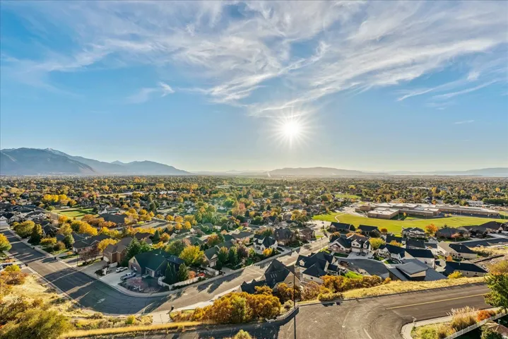 Aerial perspective of suburban area with a mountain backdrop