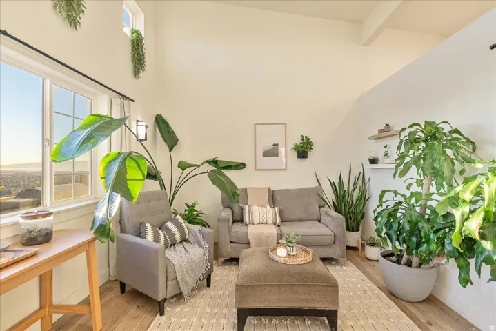 Living room featuring wood finished floors and plenty of natural light