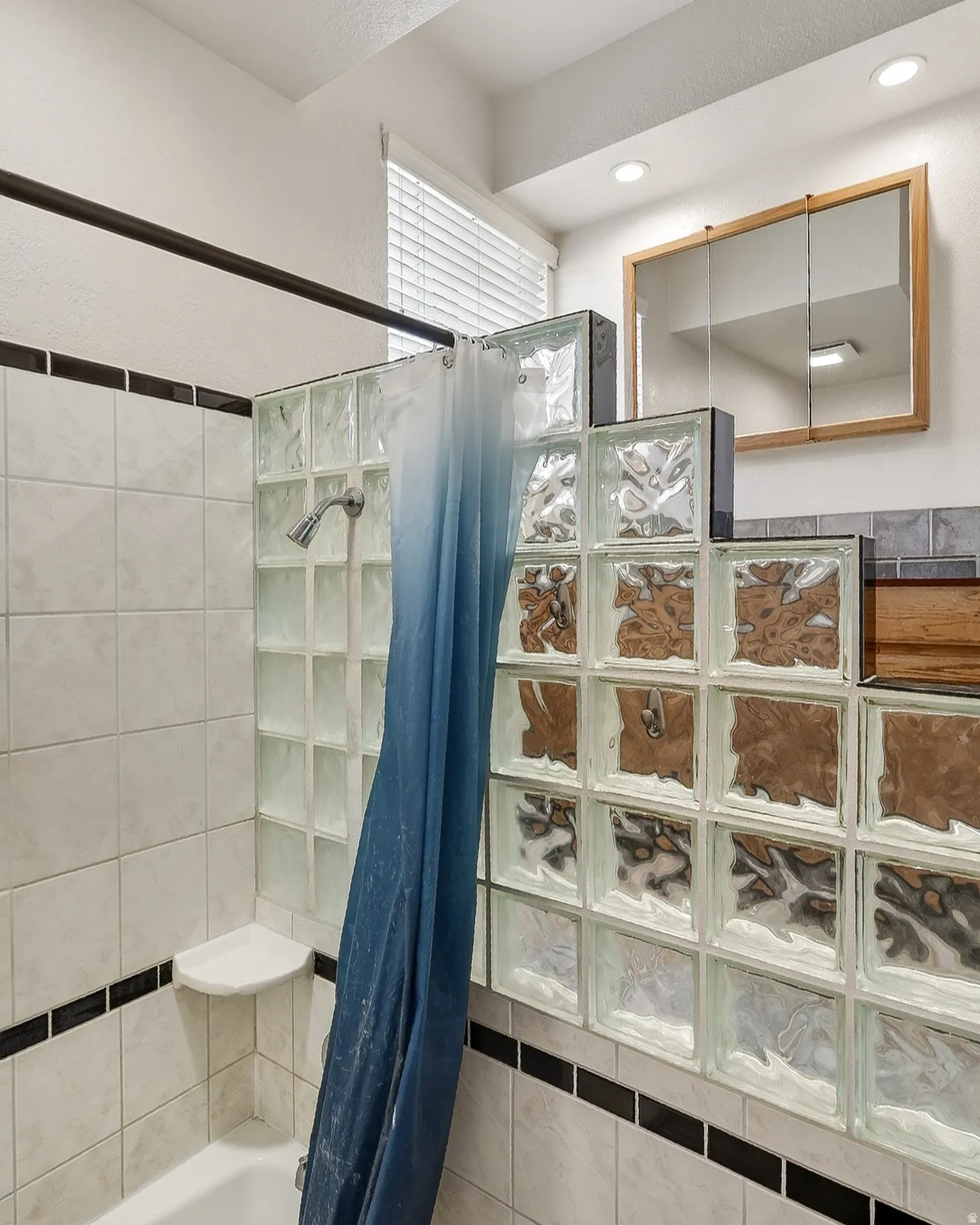 Bathroom with shower / bath combo with shower curtain