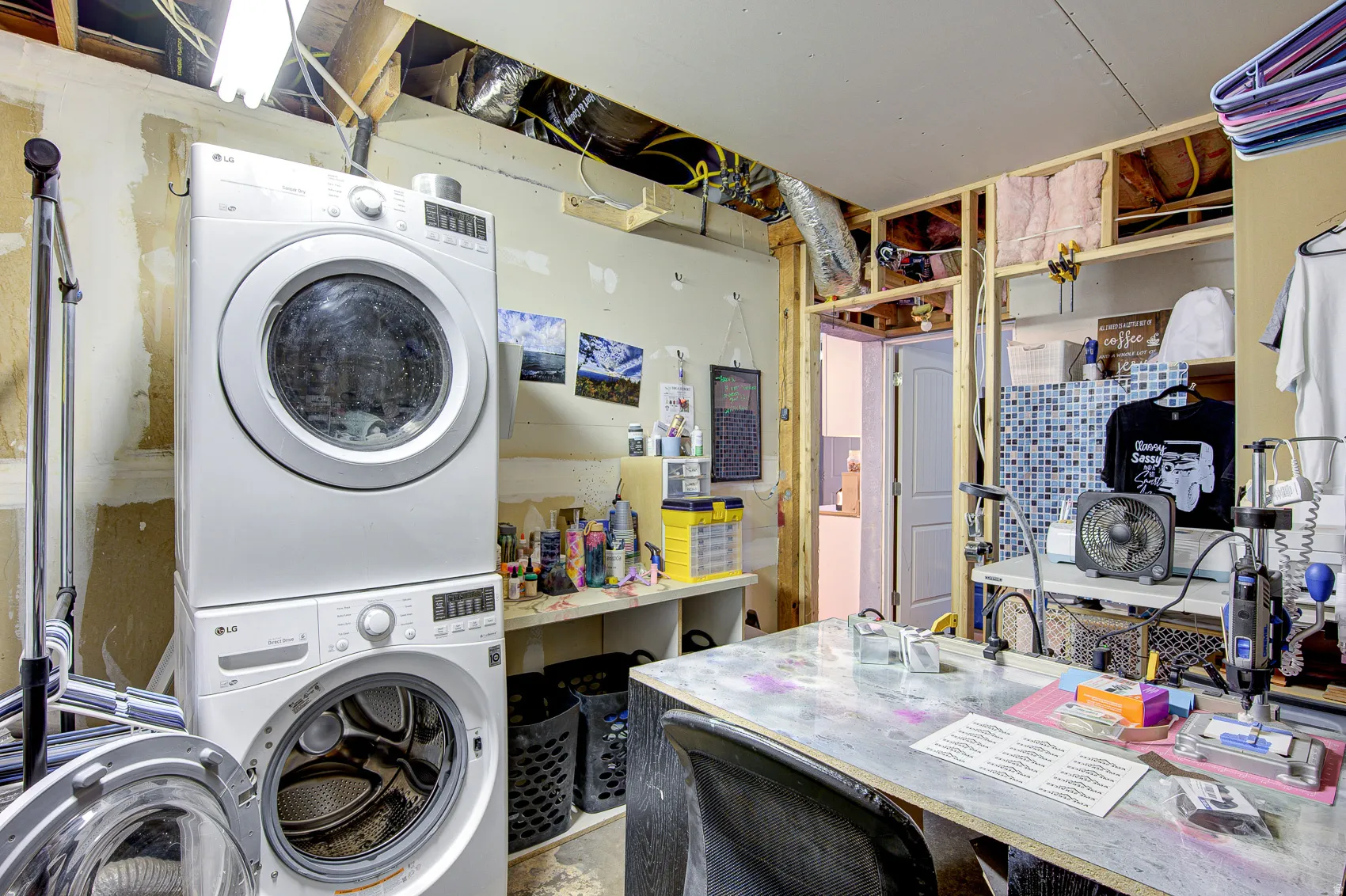 Laundry area with stacked washer / drying machine