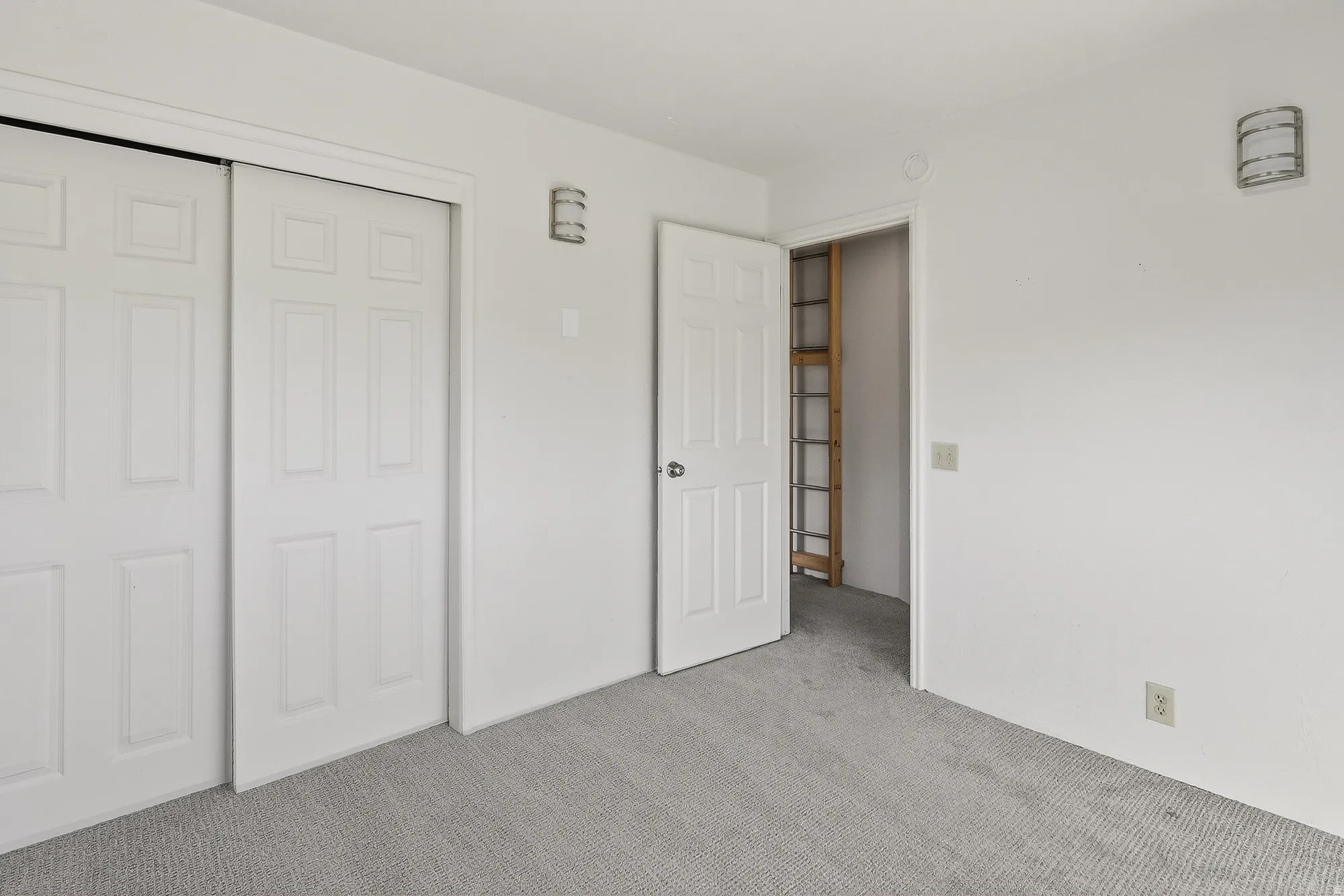 Unfurnished bedroom with carpet floors and a closet