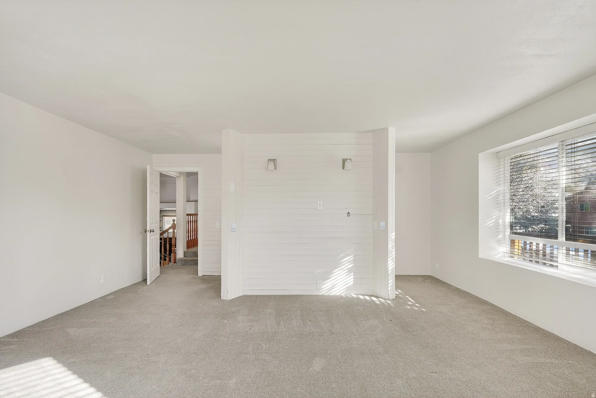 Unfurnished bedroom with carpet flooring