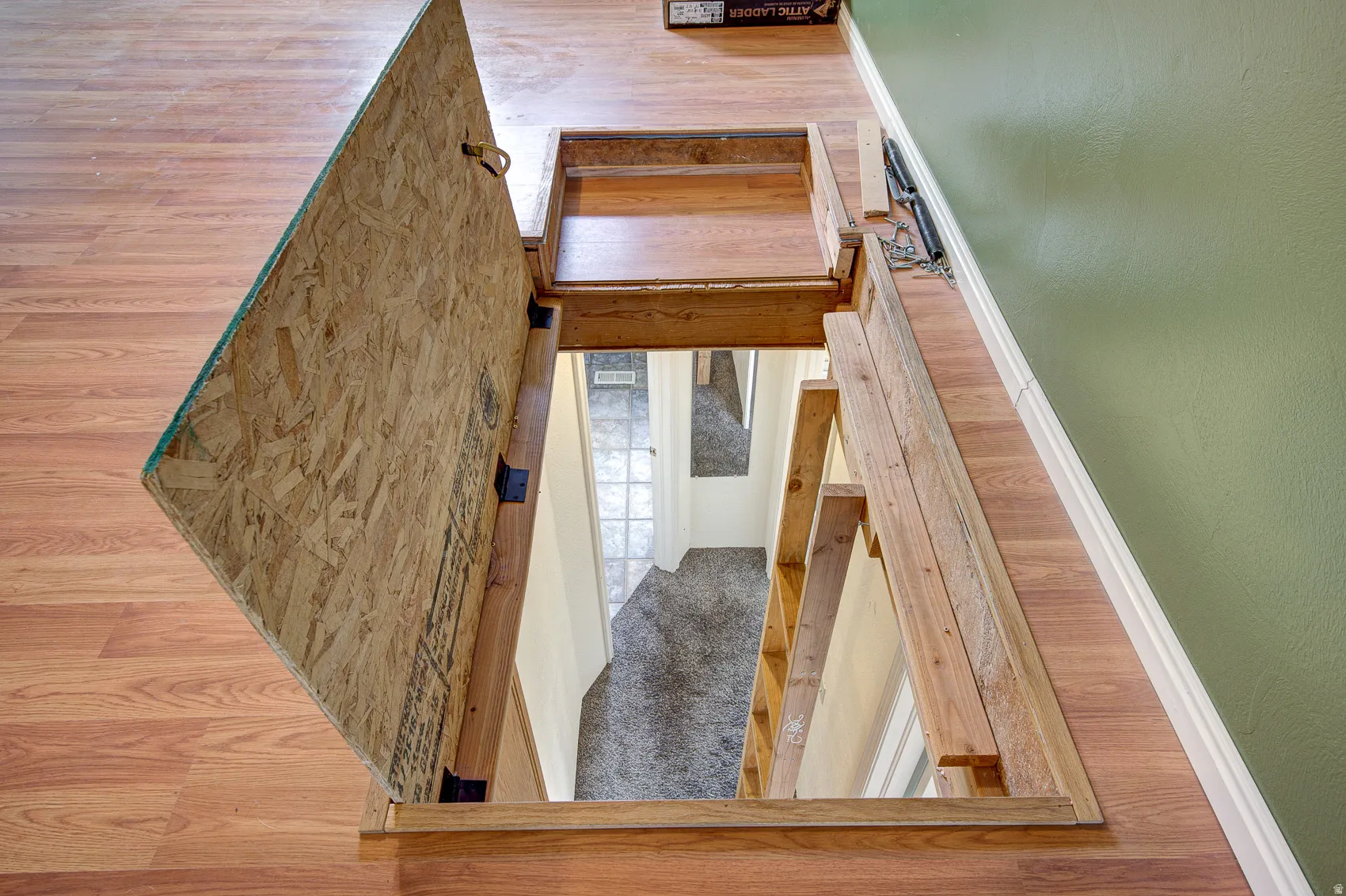 Staircase featuring carpet floors and baseboards