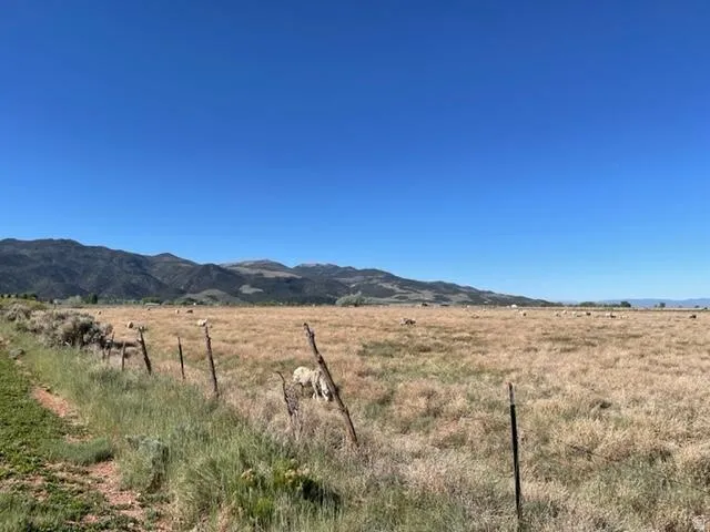 View of mountain backdrop with rural landscape