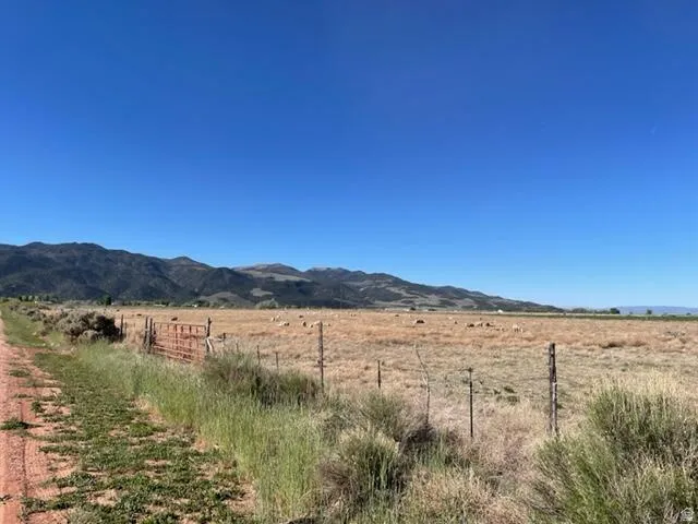 View of mountain backdrop with rural landscape