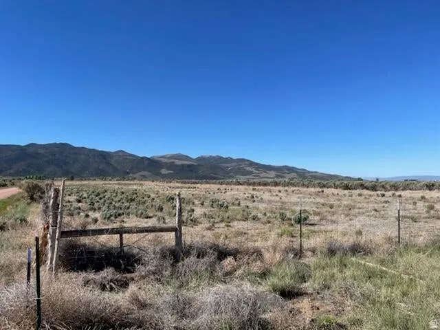 View of mountain backdrop featuring rural landscape
