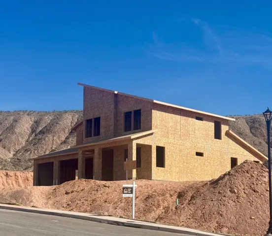 View of front facade featuring a mountain view and a garage