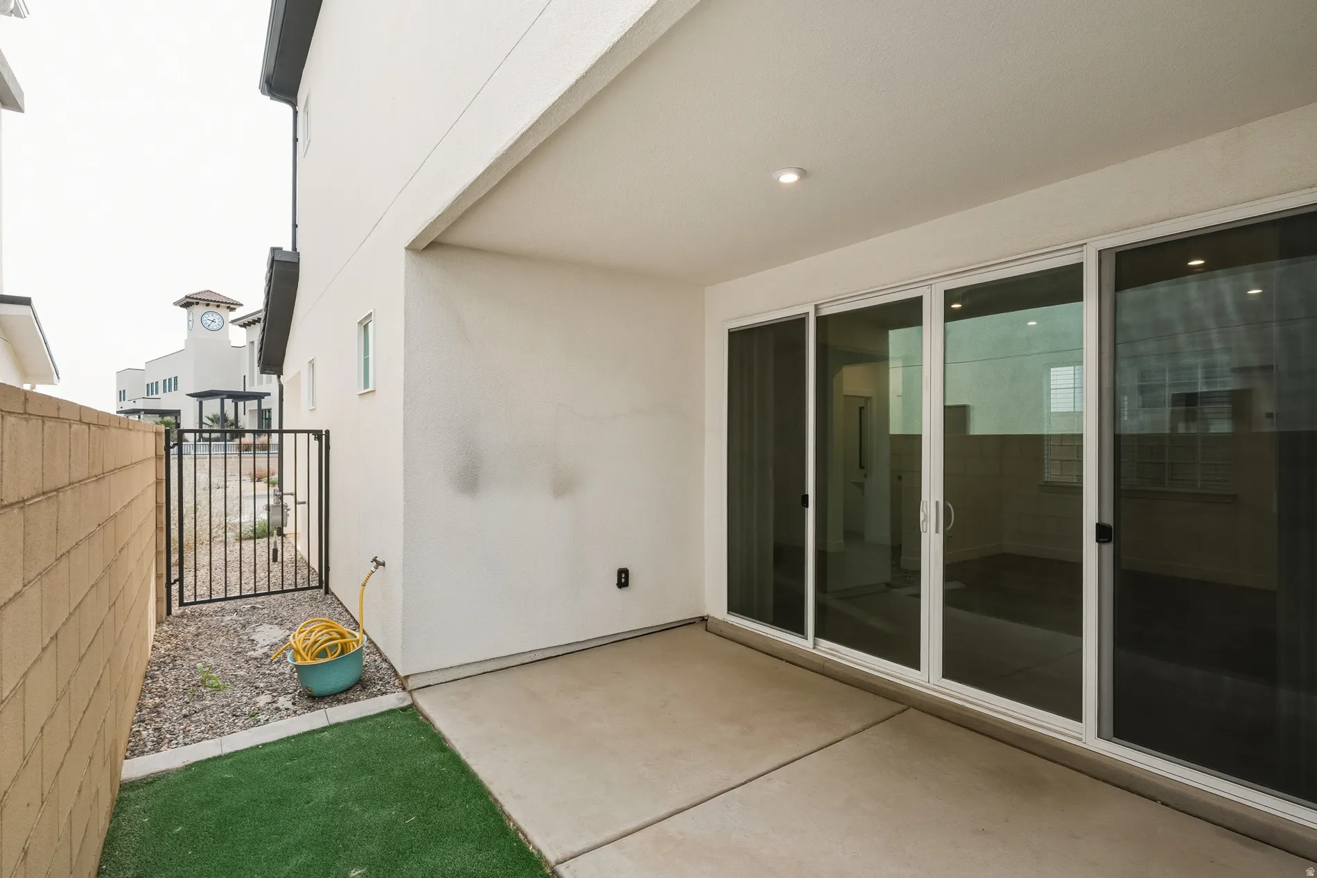 View of patio with a gate