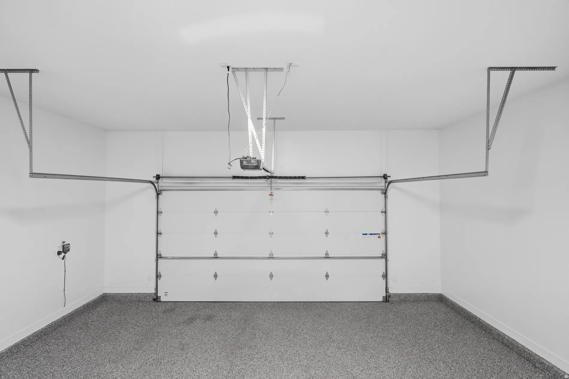 Garage featuring baseboards