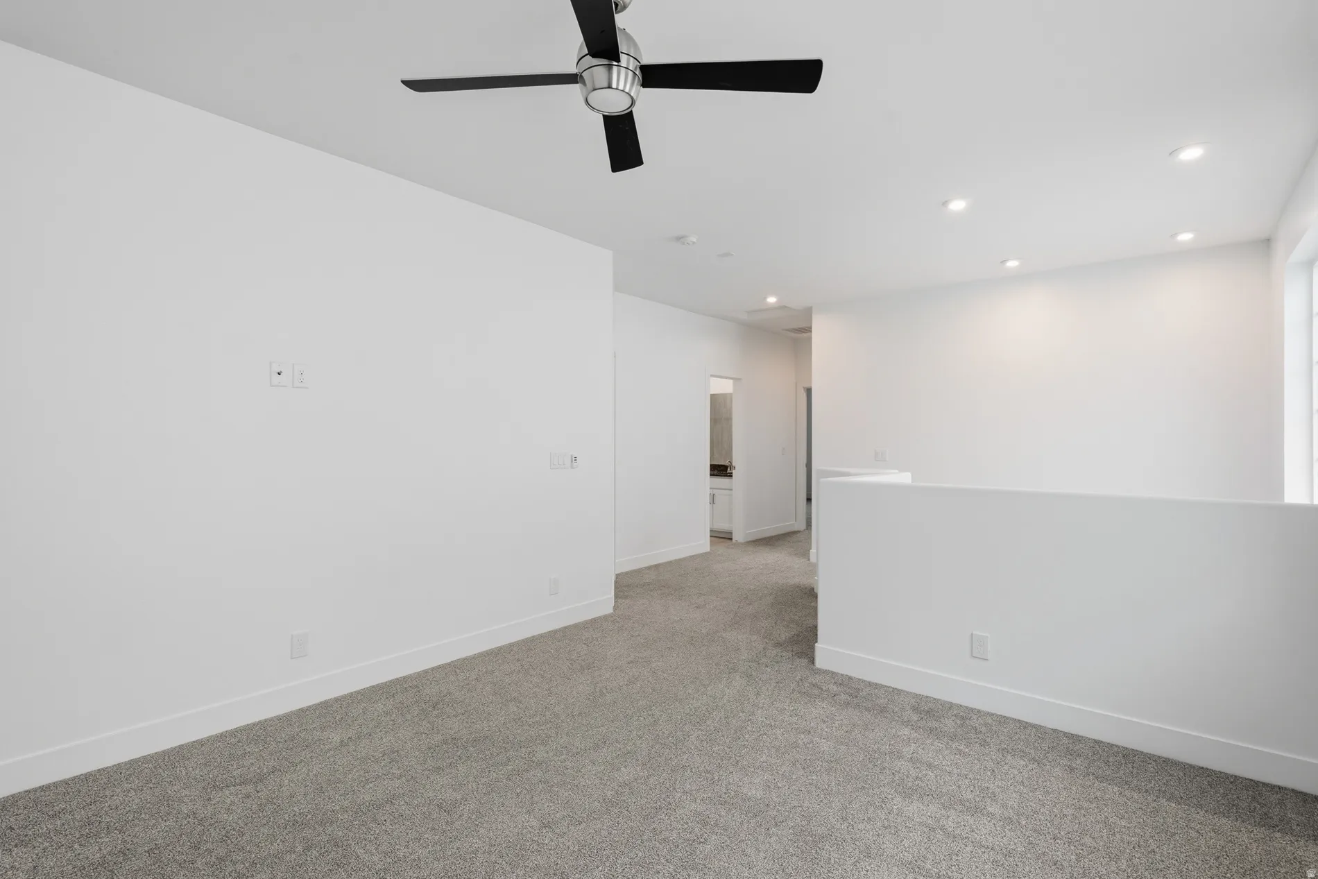 Unfurnished room with recessed lighting, light colored carpet, and a ceiling fan