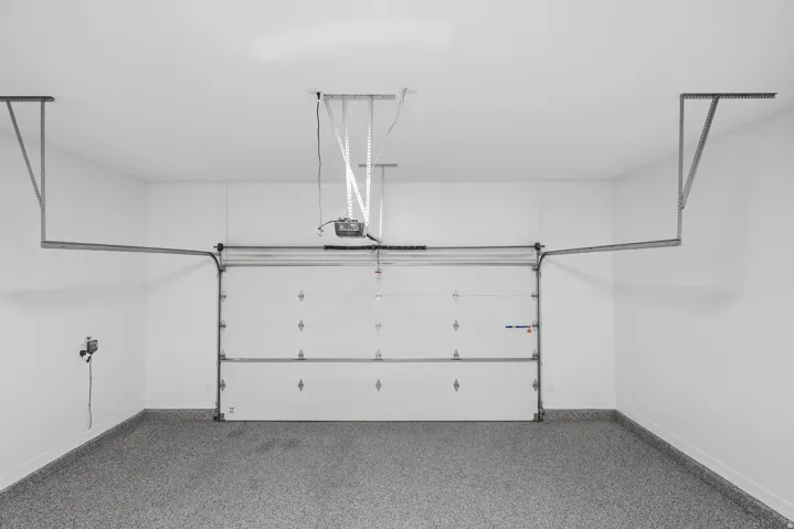 Garage featuring baseboards