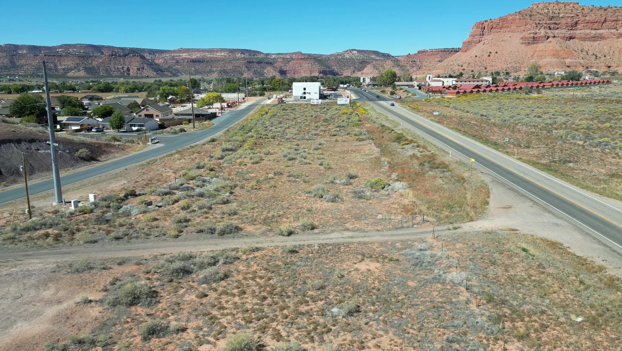 View of asphalt road with a mountain view and a view of rural / pastoral area