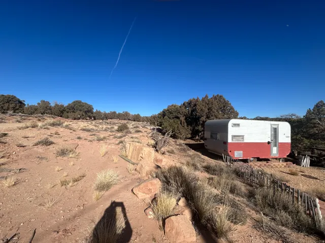 View of yard featuring a rural view and an outbuilding